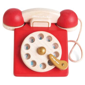Drewniany czerwony telefon zabawkowy vintage z tarczą do wybierania numerów do odgrywania ról dla dzieci. Le Toy Van Telefon Vintage