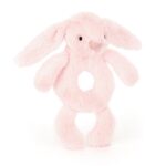 Jasno różowy pluszowy króliczek grzechotka z otworem w środku dla niemowlaka. Jellycat Króliczek Grzechotka Jasno Różowa 18 cm Przytulanka Króliczki