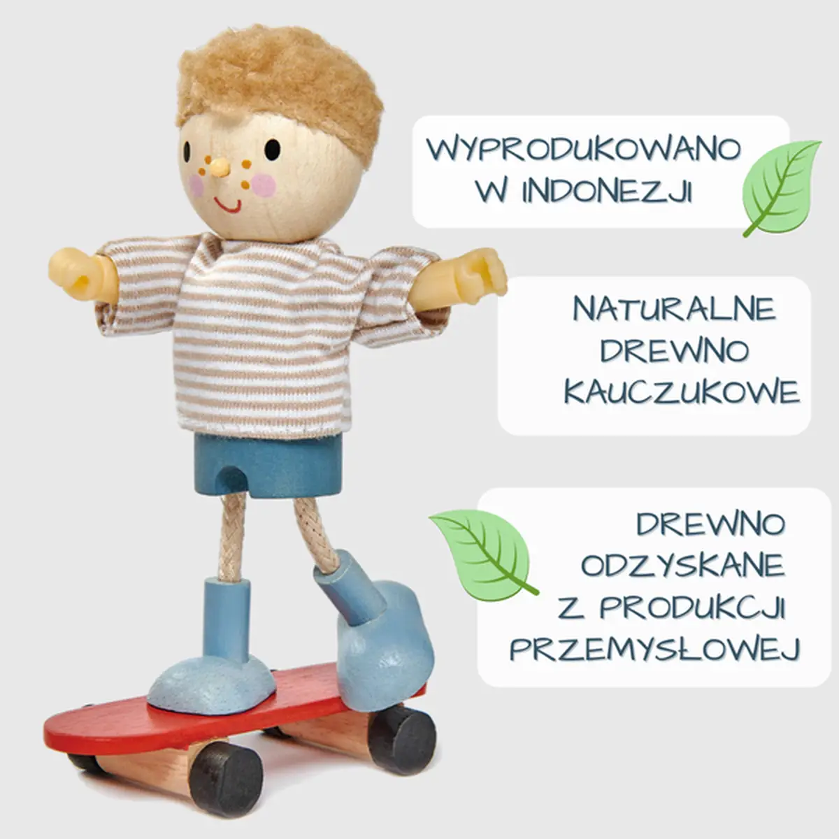 Drewniana laleczka chłopiec na czerwonej deskorolce ubrany w niebieskie buty i pasiasty sweter dla dziecka do domku. Tender Leaf Toys Laleczka Edward na deskorolce