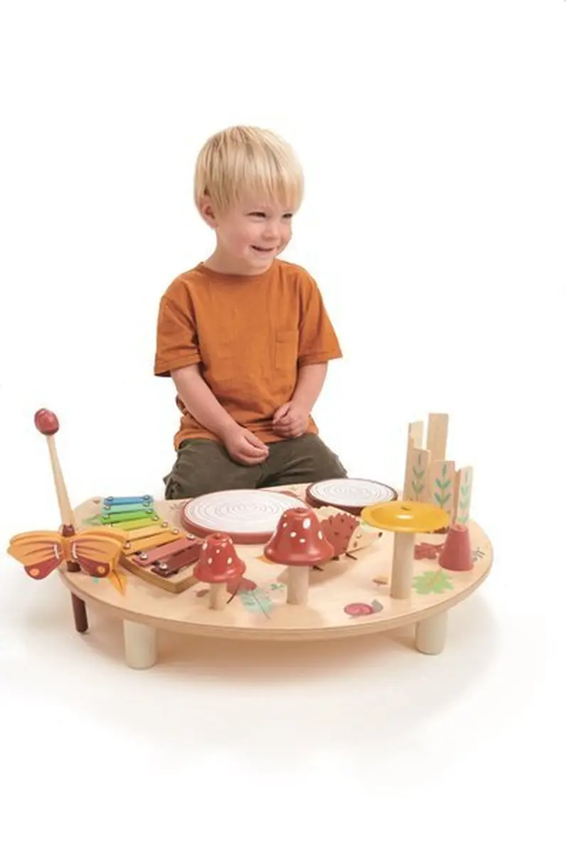 Drewniany stolik muzyczny z różnymi instrumentami dla dziecka z motywem grzybów i kolorowymi elementami. Tender Leaf Toys Drewniany stolik muzyczny