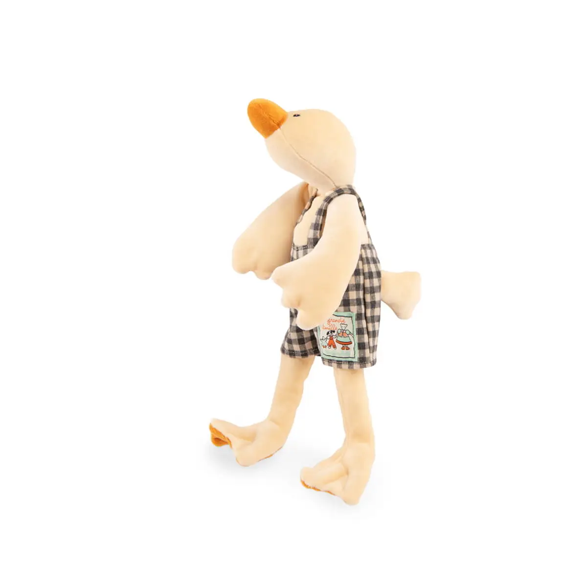 Pluszowa maskotka gąska w beżowym kolorze ubrana w kraciasty kombinezon dla dziecka. Moulin Roty Maskotka gąska Amedee 33cm