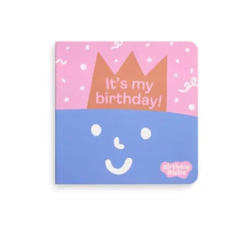 Kolorowa książka dla dzieci z okienkami z napisem It’s my birthday i rysunkiem uśmiechniętej twarzy z koroną na różowo-niebieskim tle. ergoPouch Książka z Okienkami Urodziny: It’s My Birthday
