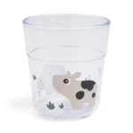 Przezroczysty kubek dla dziecka z nadrukiem krowy i roślin w kolorze piaskowym 220 ml. Done by Deer Kubek dla Dziecka Glass L 220ml Tiny Farm Sand 220 ml