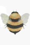 Dywan bawełniany w kształcie pszczoły z żółto-czarnymi paskami i białymi skrzydłami dla dzieci. Lorena Canals Dywna bawełniany Bee do prania w pralce Planet Bee
