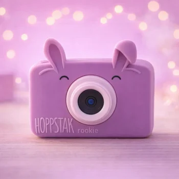 Fioletowy aparat fotograficzny dla dzieci z uszami króliczka i obiektywem na środku. Hoppstar Aparat fotograficzny dla dzieci Rookie Blossom