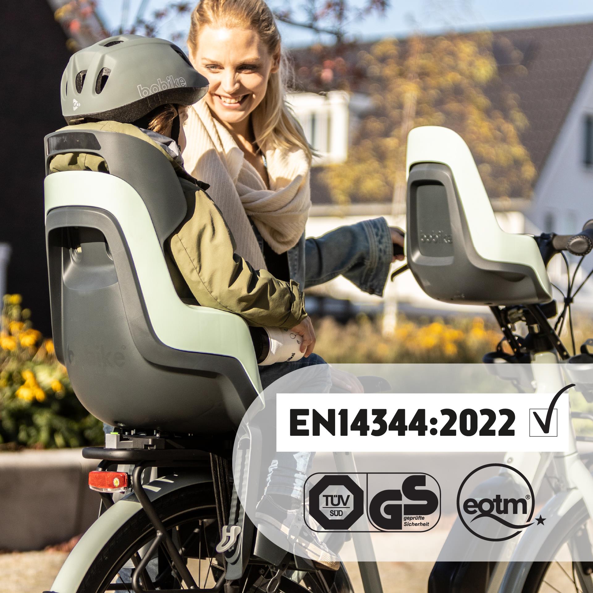 Fotelik rowerowy na bagażnik w kolorze różowym dla dziecka z pasami bezpieczeństwa. Bobike Fotelik row. GO bagażnik MIK HD Candy Pink