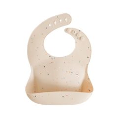 Silikonowy śliniak w kolorze waniliowym z kolorowymi kropkami dla dziecka. Mushie Śliniak Silikonowy Vanilla Confetti