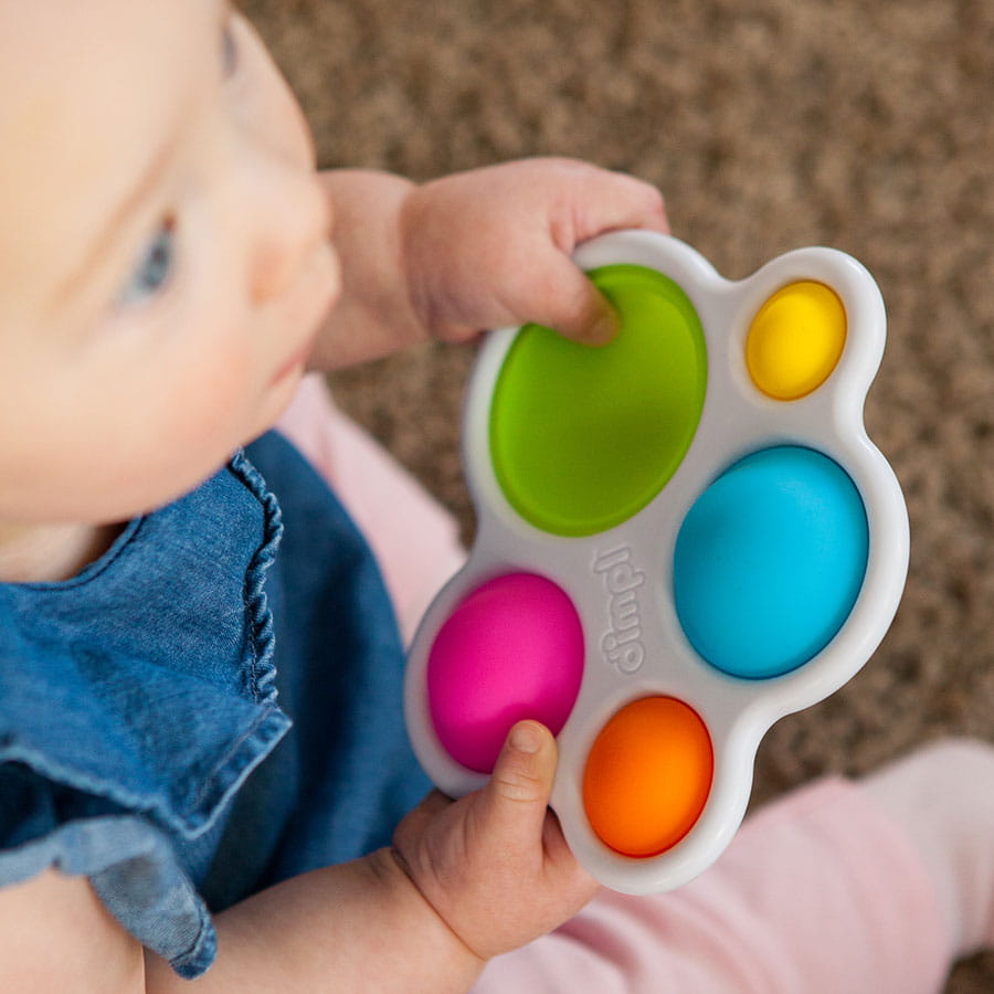 Zabawka sensoryczna z kolorowymi wypustkami do naciskania dla niemowlaka. Fat Brain Toy Co. Bąbelki Dimpl