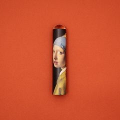 Kalejdoskop z motywem obrazu Dziewczyna z perłą Johannes Vermeer na pomarańczowym tle. Londji Kalejdoskop Johannes Vermeer Dziewczyna z Perłą
